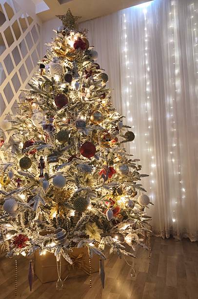 istock Beautiful Christmas tree in the room at night 2252066970