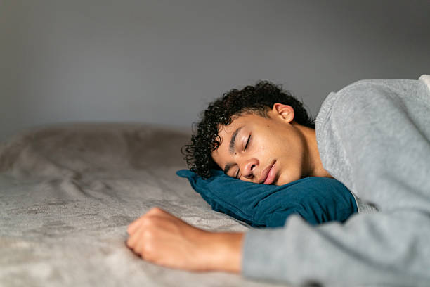 istock Teenage boy sleeping in his bedroom 2252069093