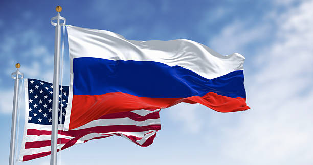 istock Russian and American flags waving side by side in wind. 3D render 2252070087
