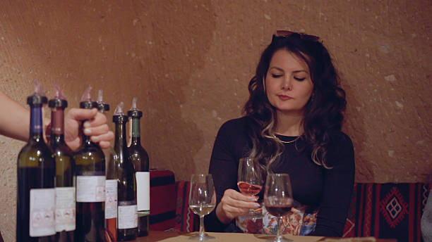 istock Two women enjoying a wine tasting experience in a cozy winery 2252072221