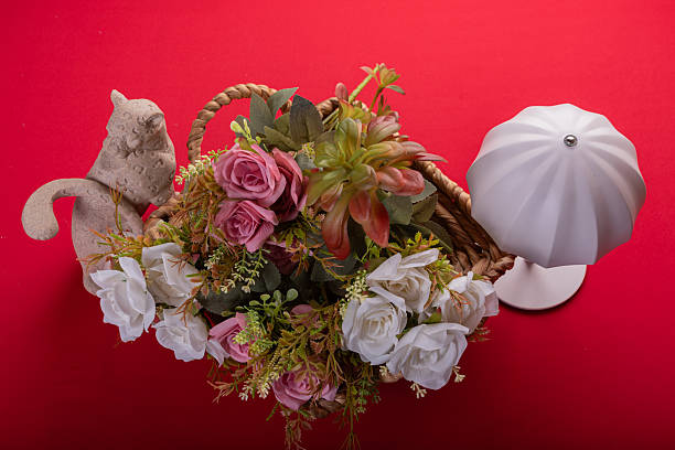 Minimal floral arrangement on red surface