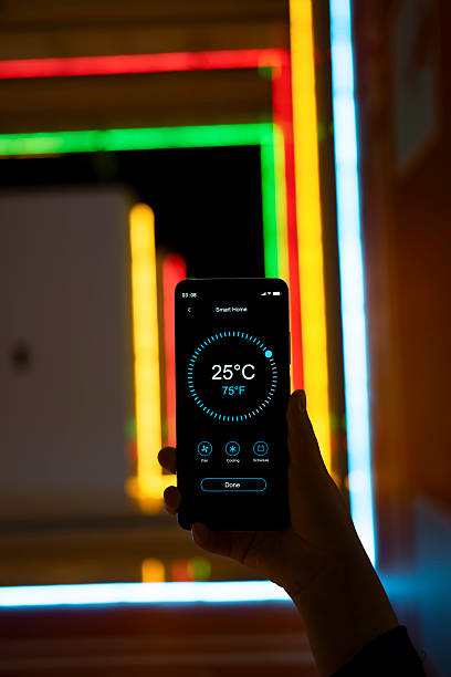 istock Using smart home with handheld mobile phones at home 2252075729
