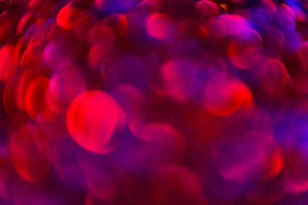 Glitter backdrop. Colorful light reflections. Glowing wallpaper for design. Radiant glitter background with vibrant bokeh. Futuristic sparkle effect. Glowing texture for banner design