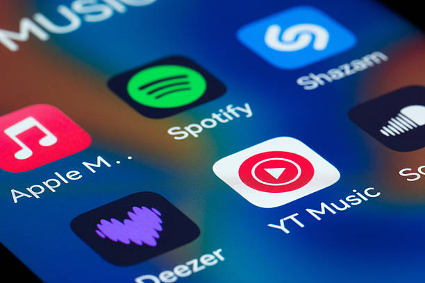 Istanbul, Turkey  December 15: Close-up view of a smartphone screen displaying popular music streaming and audio applications, including Spotify, Apple Music, Deezer, Shazam, and SoundCloud. Concept of digital music consumption, mobile entertainment, audio streaming services, and modern smartphone usage.