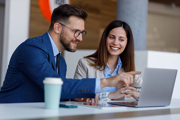 istock Business colleagues collaborating on shared project using laptop, meeting in modern office space 2252082490