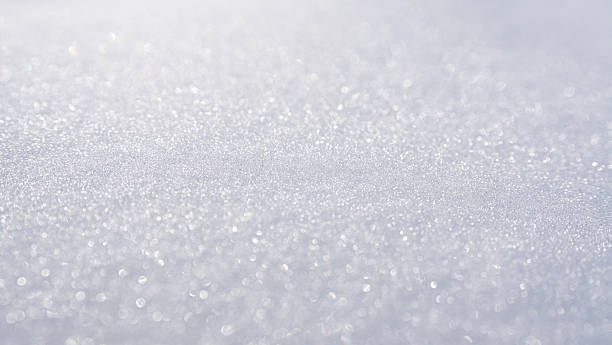 istock Snow background. Winter field with white snow texture. Winter background with snowy surface. Snowy pattern closeup. White background with snow texture. 2252082535