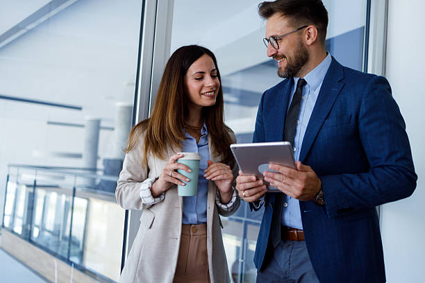 istock Business colleagues discussing project ideas using a digital tablet during a coffee break in a modern office 2252083085