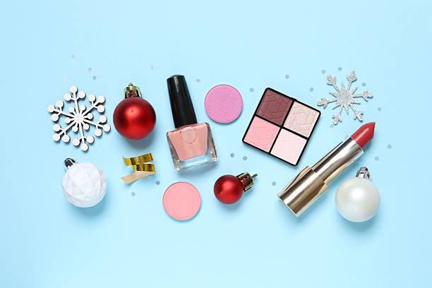 istock Flat lay composition with makeup products and Christmas decor on color background 2252084192