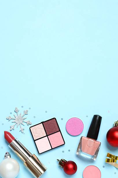 istock Flat lay composition with makeup products and Christmas decor on color background 2252084198