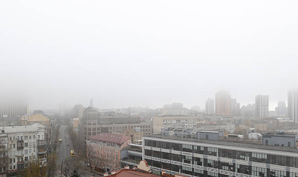 istock White winter fog over city rooftops 2252088042