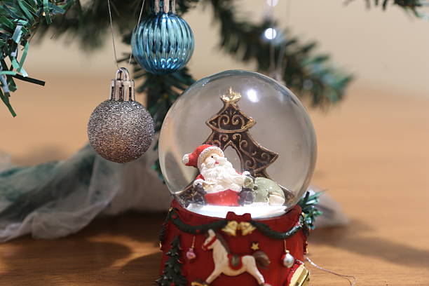 Christmas tree artifact with Christmas balls and a toy with St. Nicholas (if you turn it over, snow)