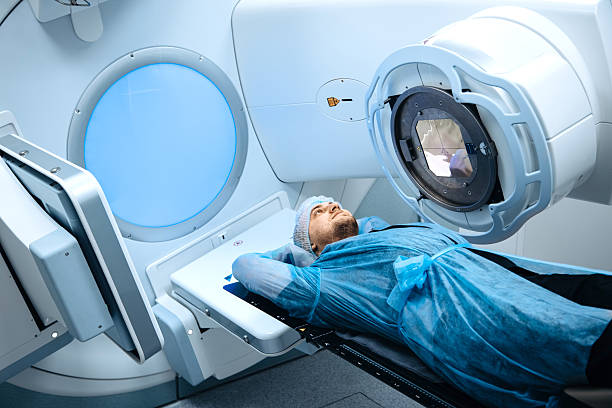 istock Linear accelerator in oncology treatment room, patient lying on treatment table 2252089280