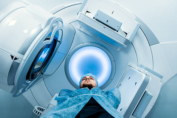 istock Linear accelerator in oncology treatment room, patient lying on treatment table 2252089291