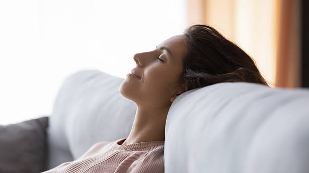 istock Tranquil young pretty woman sleeping on comfortable couch. 2252089294