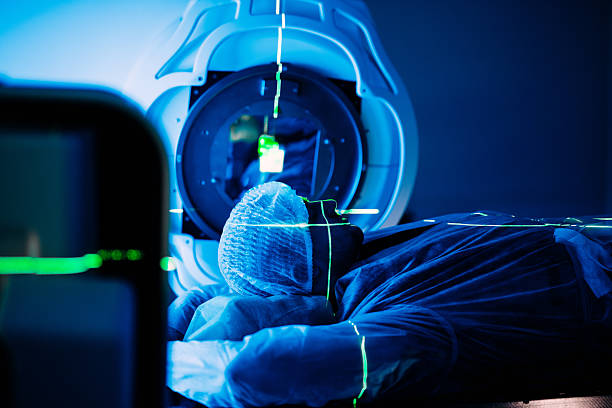 istock Linear accelerator in oncology treatment room, patient positioned for therapy 2252089351