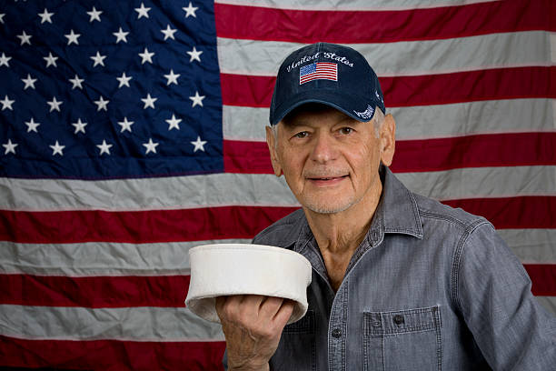 istock American Senior Veteran proudly displaying old sailor hat 2252091357