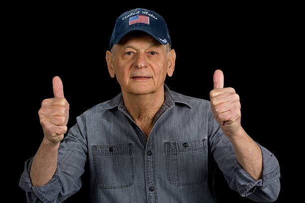 Senior Business Man CEO holding up one finger showing success and job well done