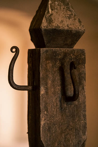istock rusty iron hooks, artisan wrought iron hooks attached to historic weathered stone in parma cloister 2252092901