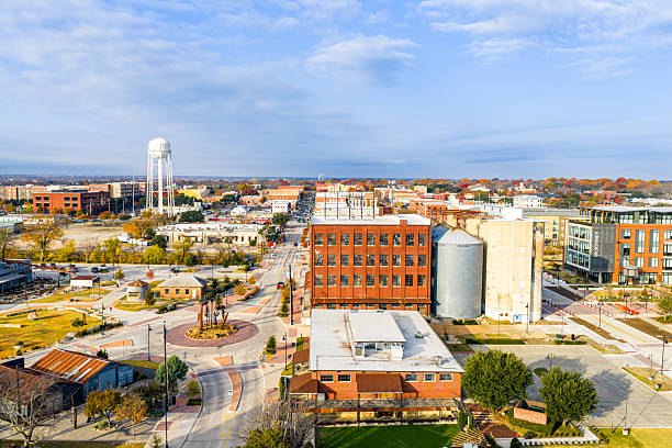istock Water tower at McKinney Texas Drone Video in Historic square on Beautiful Fall Day with Autumn colors on the leaves 2252100529