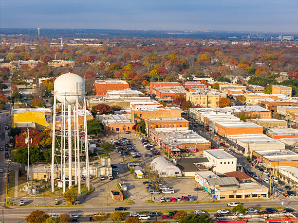 istock Water tower at McKinney Texas Drone Video in Historic square on Beautiful Fall Day with Autumn colors on the leaves 2252100575