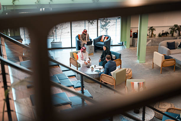 istock Middle Eastern Business Professionals Collaborating with Young Caucasian Partner in Modern Office Setting 2252104918