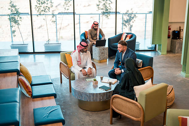 istock Middle Eastern Business Professionals in Collaborative Meeting with Young Caucasian Partner in Modern Office 2252104922