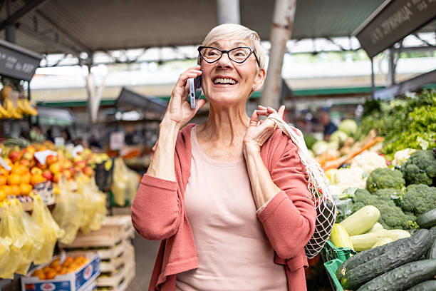 istock Senior lady happily chatting on phone 2252108916