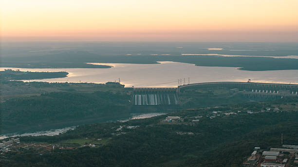 High Voltage Power Tower with Itaipu Hydroelectric Dam Behind