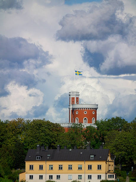 Typical gorgeous sky acts as backdrop to Stockholm's famous Kastelholman Island. Swedish flag flies for extra pride. 2011