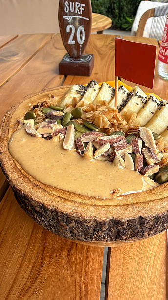 Vegan Smoothie Bowl with Banana and Nut Toppings