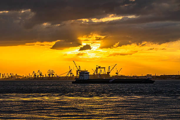 istock Sunset over the port silhouette 2252117500