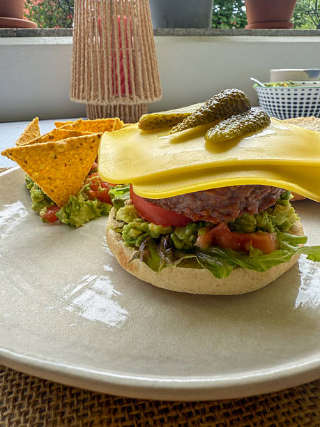 Plant Based Cheeseburger with Pickles and Nachos Plate