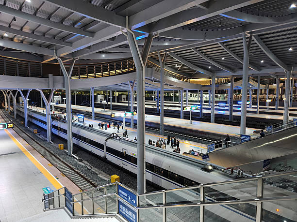 At the railway station in the evening, many people were standing on the platform, getting ready to board the train