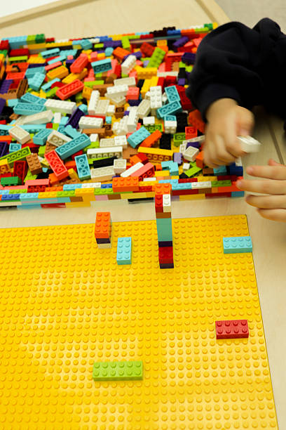 istock Colorful Building Blocks Play on Yellow Mat 2252122442