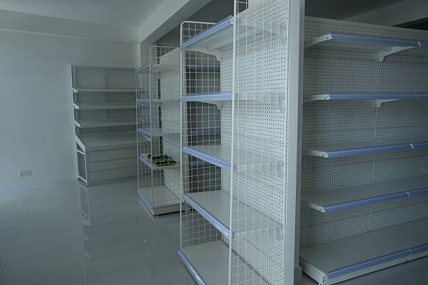 istock Empty retail shelving units in a vacant store room 2252126488