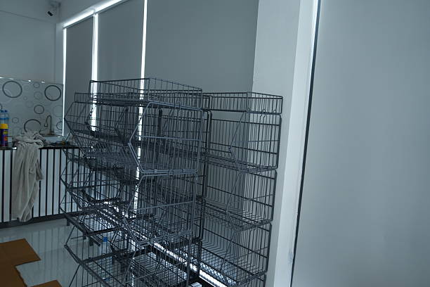 istock Empty wire shelving units stacked in modern storage room 2252126496