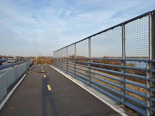 istock Shadow on a Paved Running and Biking Trail in Brooklyn, New York at Sunset 2252128263