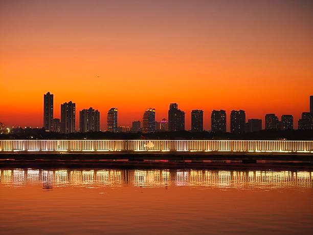 An orange sky, a city by the water