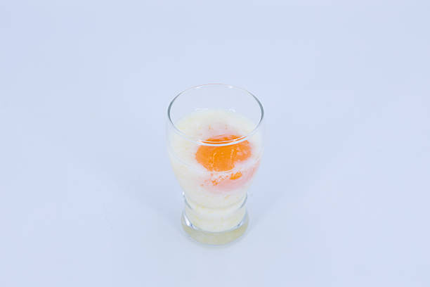 istock Soft Boiled Egg in Glass with Milk on White Background 2252136100