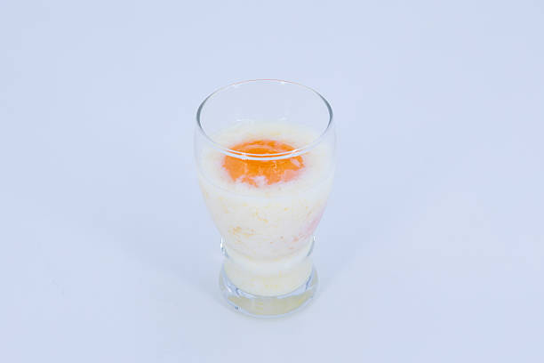 istock Soft Boiled Egg in Glass with Milk on White Background 2252136140