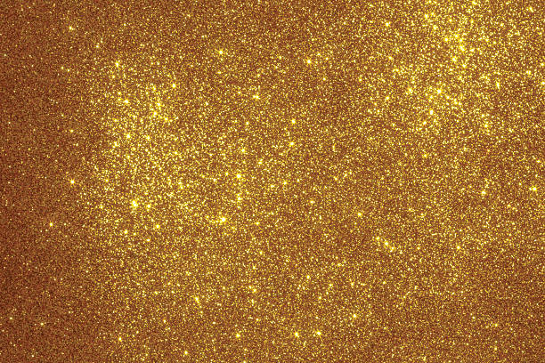 istock Gold Glitter Texture Background with Sparkling Particles 2252137386