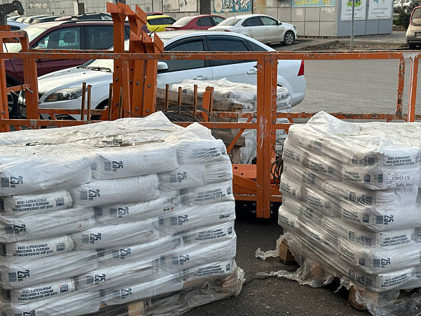 istock Workers are preparing construction materials on pallets for transportation in the city 2252137827
