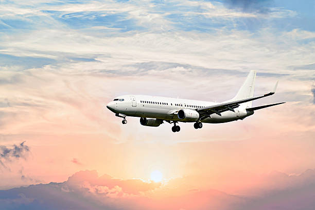 istock Passenger plane landing at the airport, under a blue sky with white clouds 2252139073