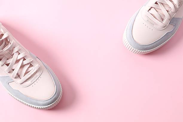 istock Pair of stylish sneakers on a colored background 2252140207