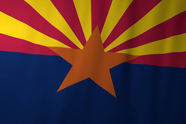 The official flag of Arizona featuring red and yellow rays symbolizing the western sunset, a central copper star, and a deep blue lower half. The design represents the state's copper mining heritage, natural beauty, and connection to the American West.