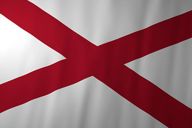 The official flag of Alabama featuring a bold red diagonal cross, known as a saltire, on a white background. The simple and historic design reflects the state’s heritage and its connection to Southern identity.