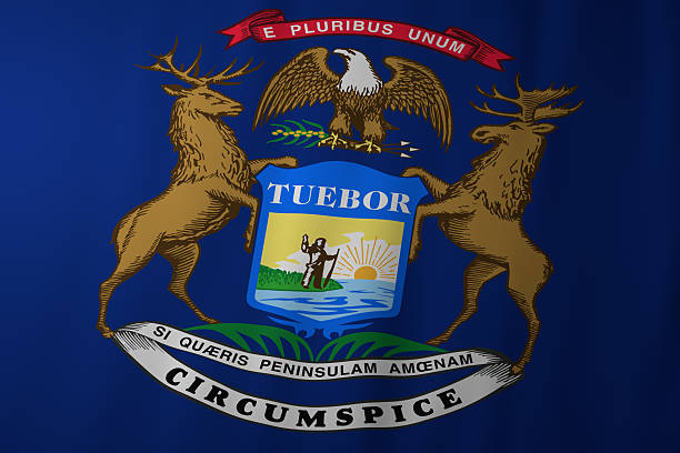 The official flag of Michigan featuring the state coat of arms with an eagle, elk, and moose surrounding a central shield. Set on a deep blue background, the design symbolizes unity, strength, and the natural heritage of the Great Lakes State.