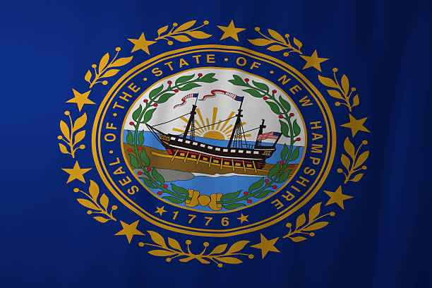 The official flag of New Hampshire featuring a deep blue background and the state seal with a historic ship rising before a golden sunrise, surrounded by a laurel wreath and stars representing unity and independence.