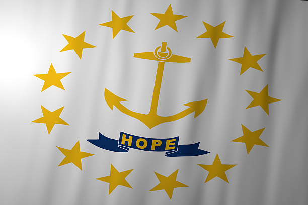 The official flag of Rhode Island featuring a gold anchor symbolizing hope, surrounded by thirteen gold stars on a white background. A blue ribbon below the anchor displays the state motto “Hope,” representing unity and historical heritage.