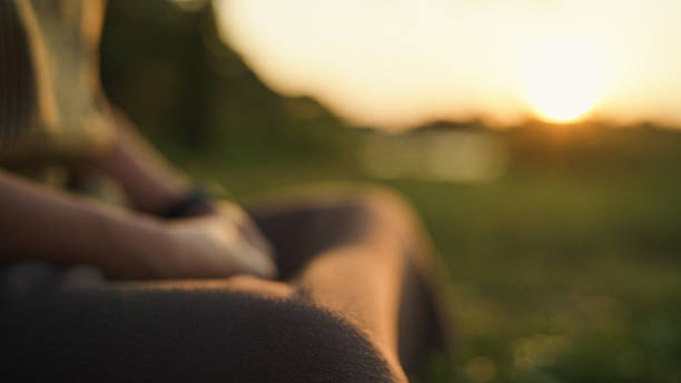 Asian mature woman relaxing in nature and enjoying a quiet moment.